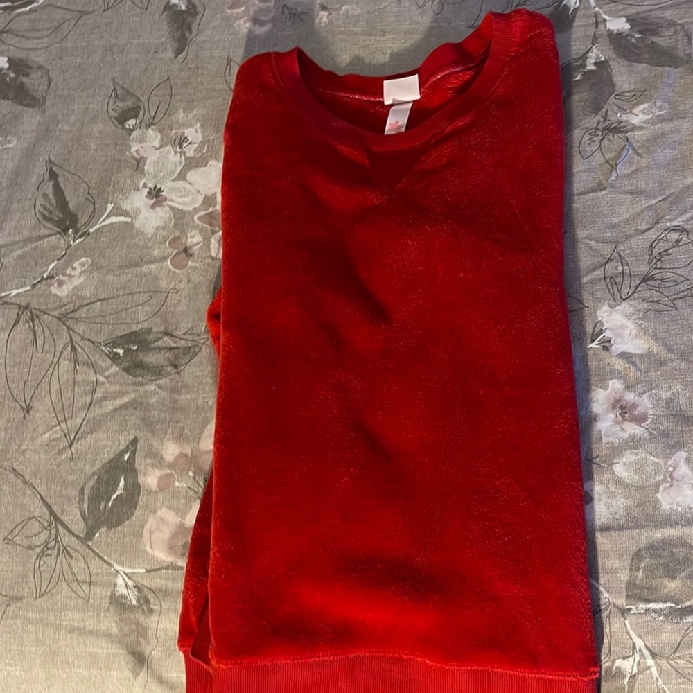 A red fuzzy sweater sleepwear, perfect for the winter and is super warm!